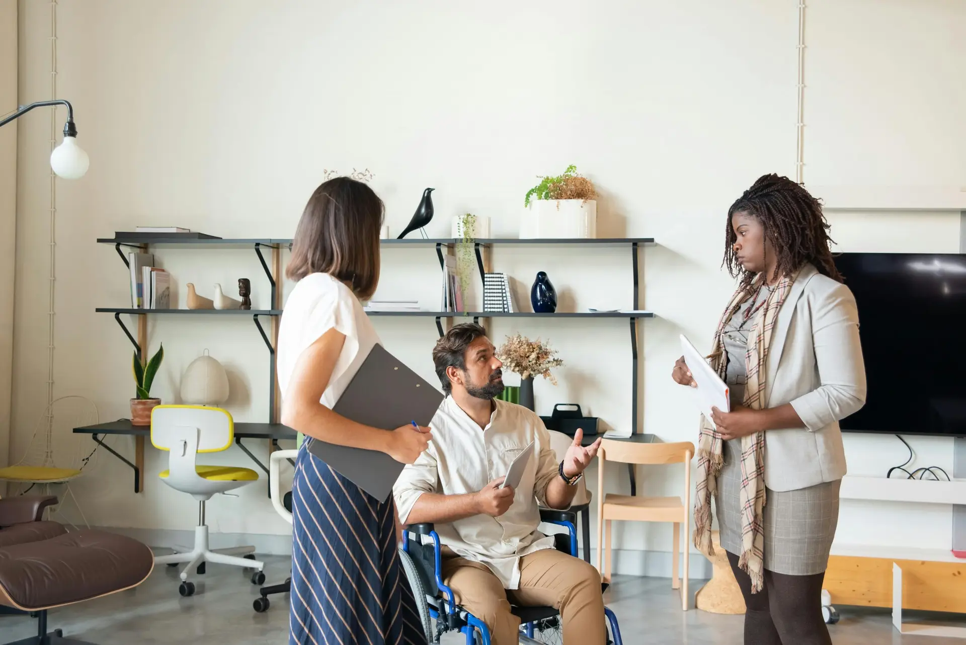 three people at a conference table hire pr agency beauty brand